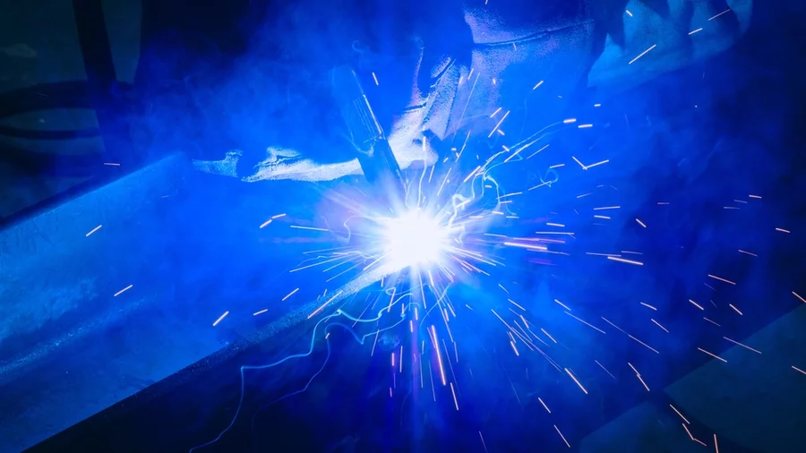 A welder with bright blue light.